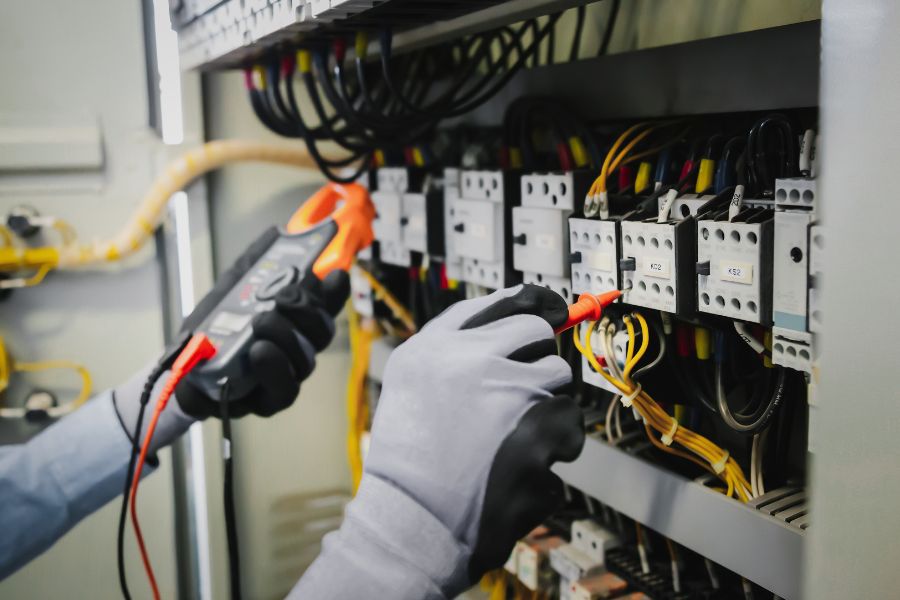 Electrician completing electrical repairs